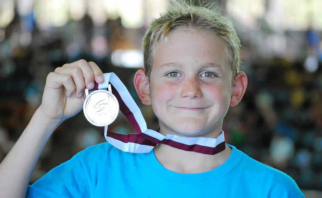 Gympie swimmer Troy Carlson with his silver medal won at the Queensland Sprint Championships in Brisbane last weekend. Gympie swimmer Troy Carlson with his silver medal won at the Queensland Sprint Championships in Brisbane last weekend.